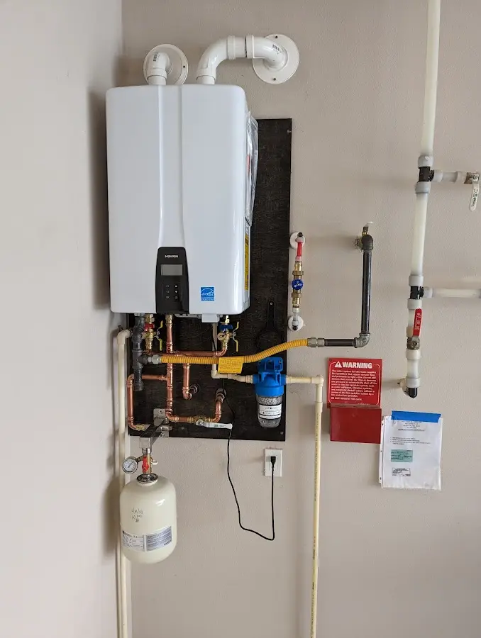 Professional plumber installing copper piping in a Rialto home